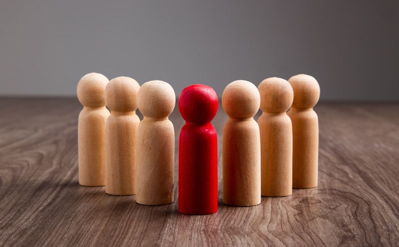 image of wooden figures to show how seo services make a website stand out from the crowd